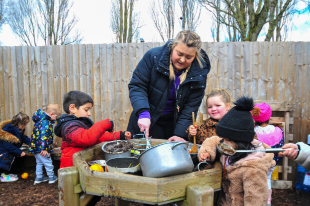 Children and an adult playing outside